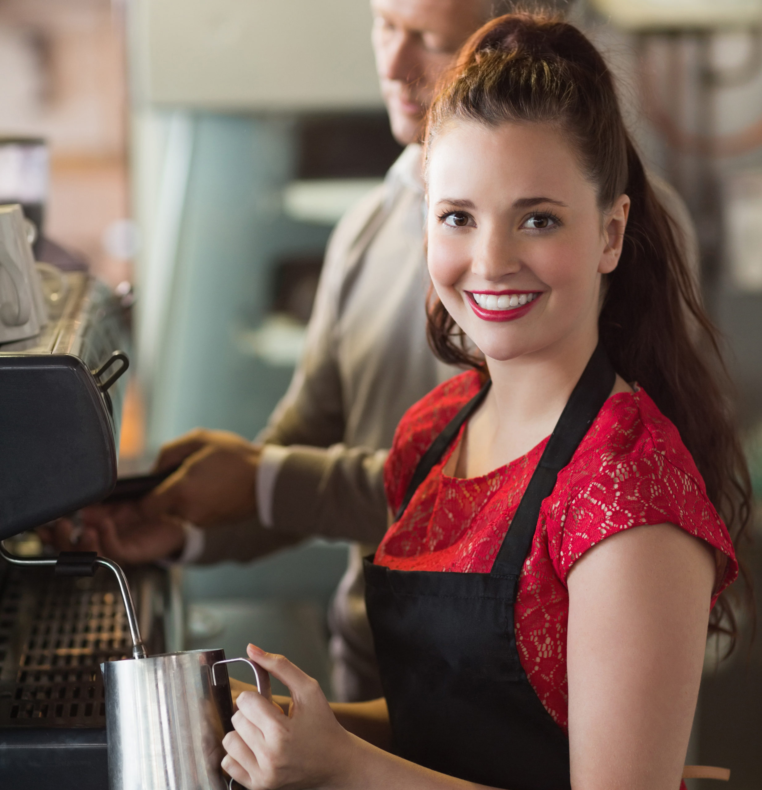 Young woman making coffee